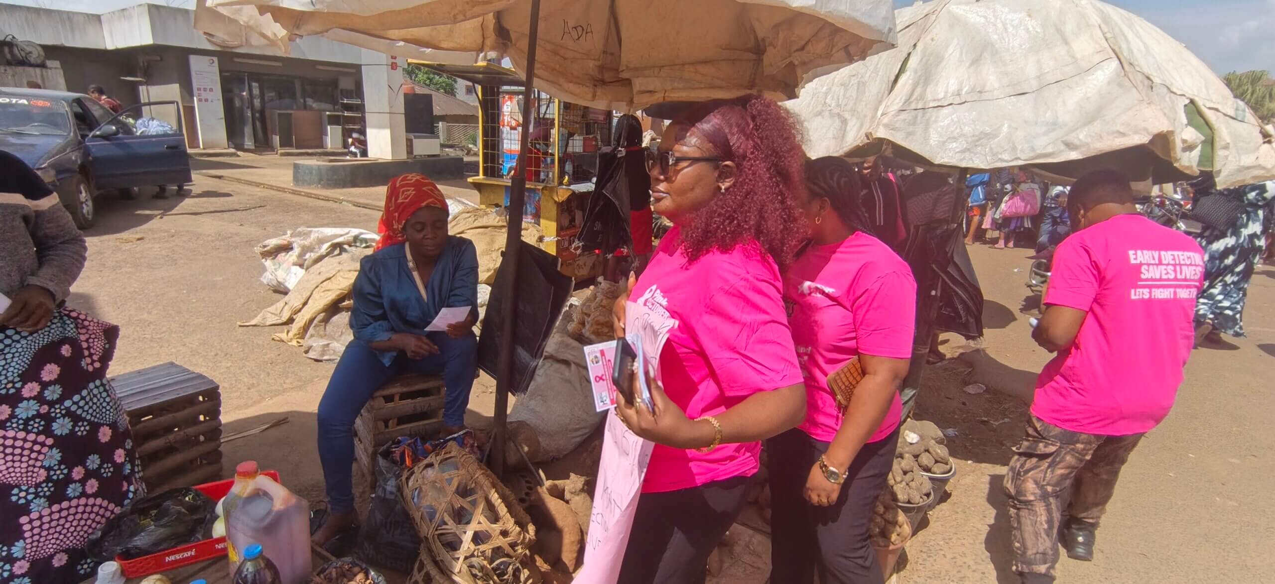HEDECS Cameroon team sharing breast cancer awareness at Bamenda Food Market.